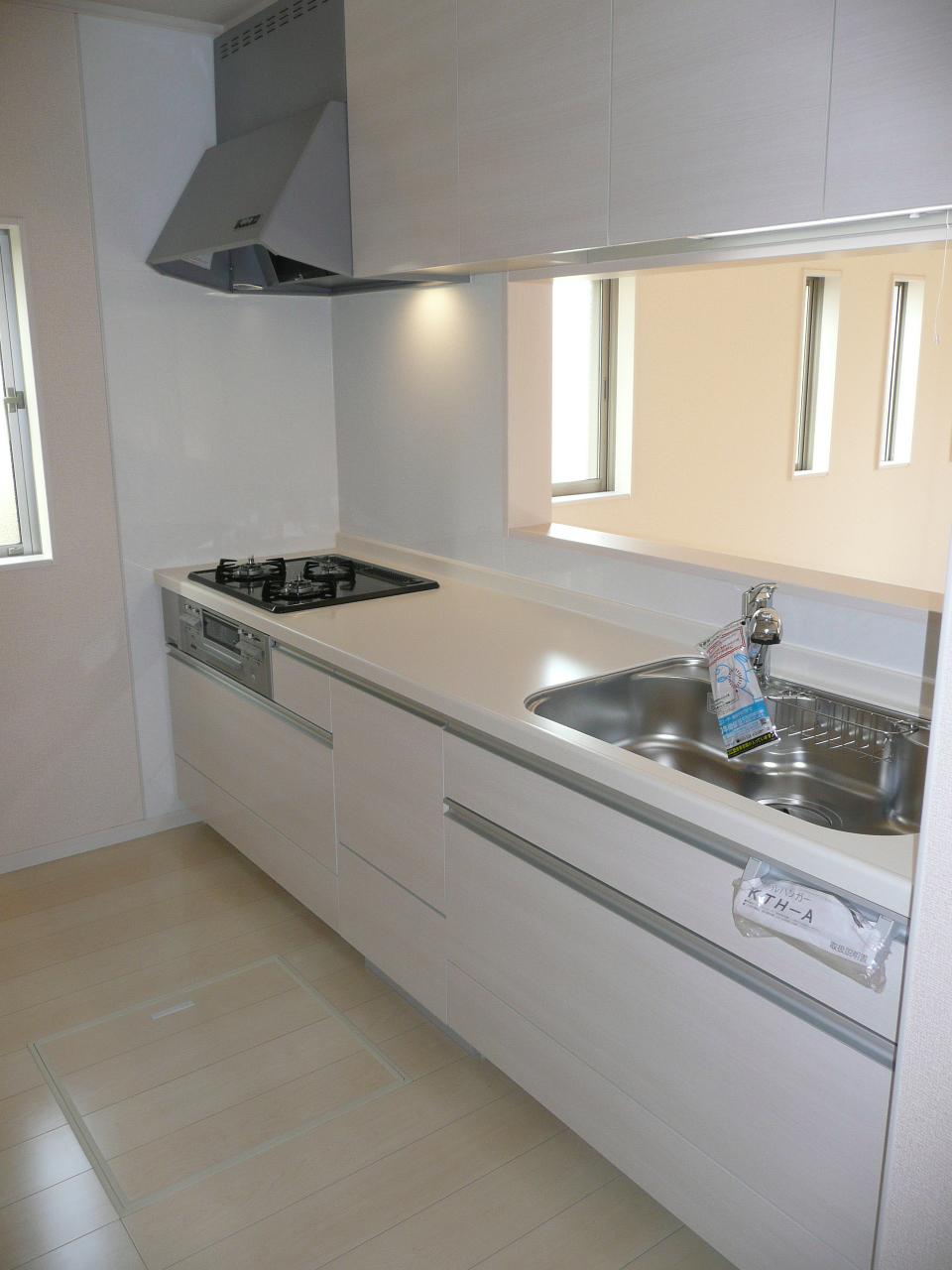 Kitchen. System kitchen sliding storage. Water purifier built-in shower faucet.