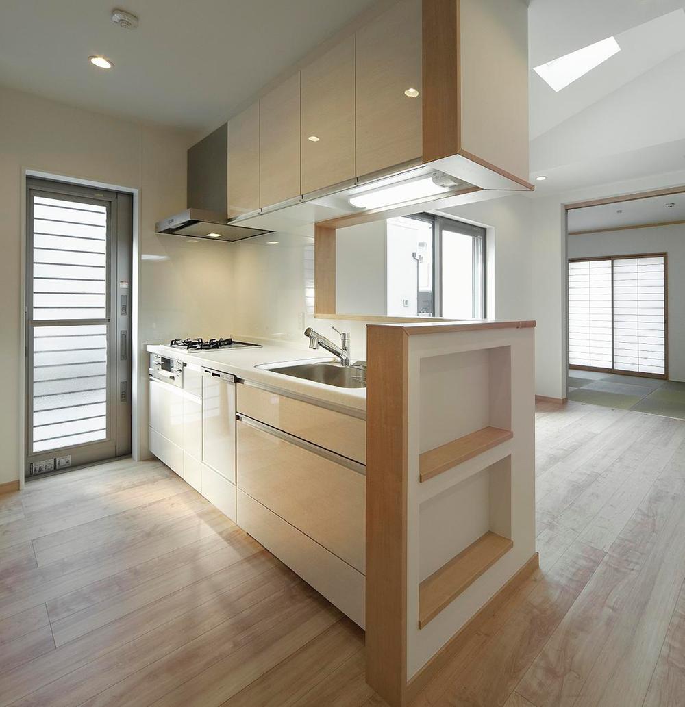 Kitchen. Photographed by local model house Soft down Wall, Dishwasher, Glass top stove, Water purifier shower faucet