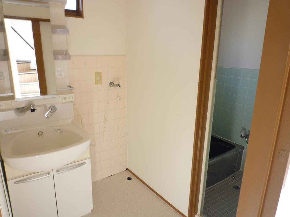 Wash basin, toilet. It is the washroom