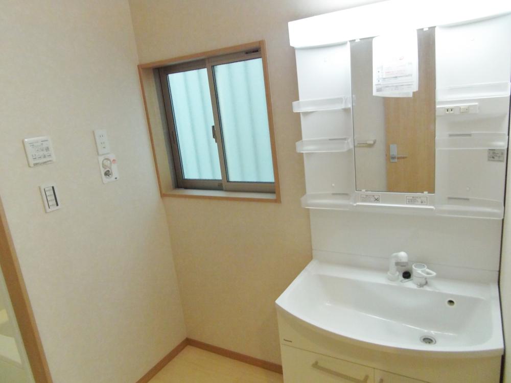 Wash basin, toilet. Washroom is based on white, It has become a finish with a clean.