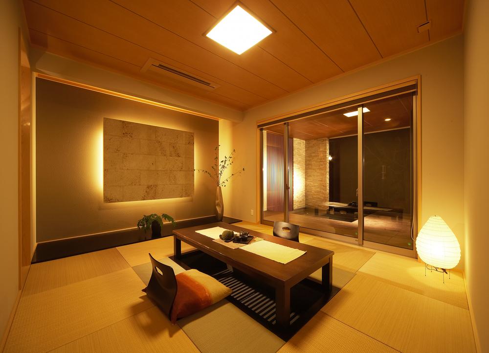 exhibition hall / Showroom. Surface lighting and Ryukyu tatami is for us to further enhance peace of sum. Since becoming your stand digging, Also it will be watching cherry blossoms and autumn leaves that look to the other side of the wood deck terrace while enjoying a cup of tea chillin. (exhibition hall)