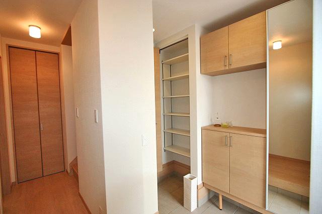 Entrance. The center of the image behind the earthen floor storage space