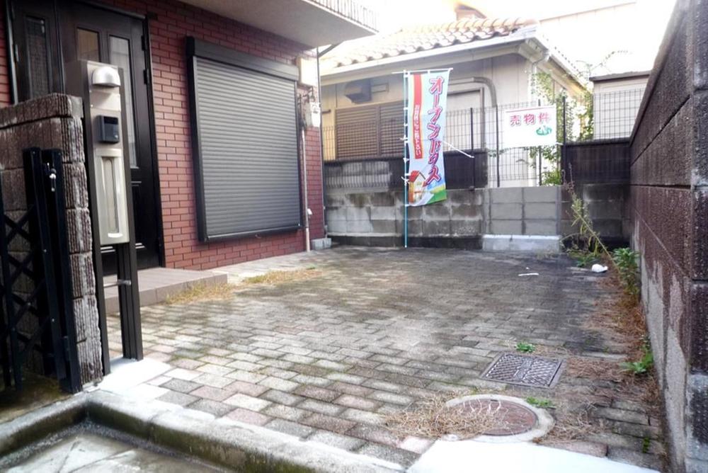 Parking lot. Entrance is the front of the parking lot. 