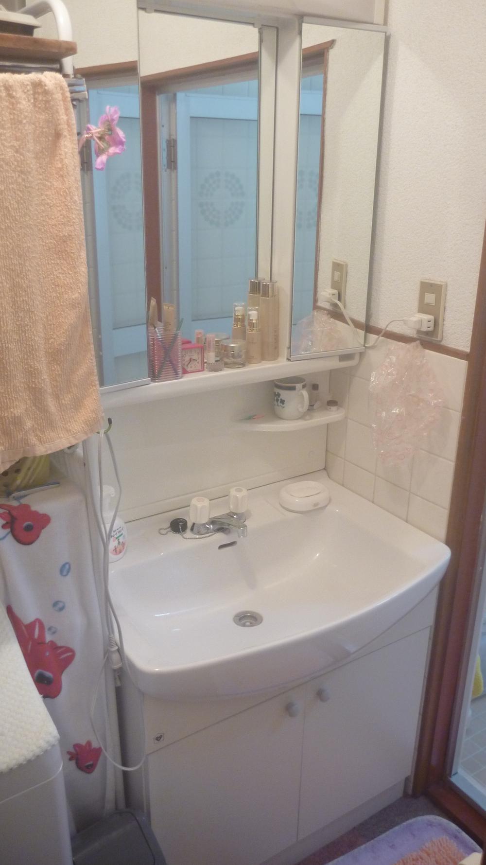 Wash basin, toilet. It is a new vanity