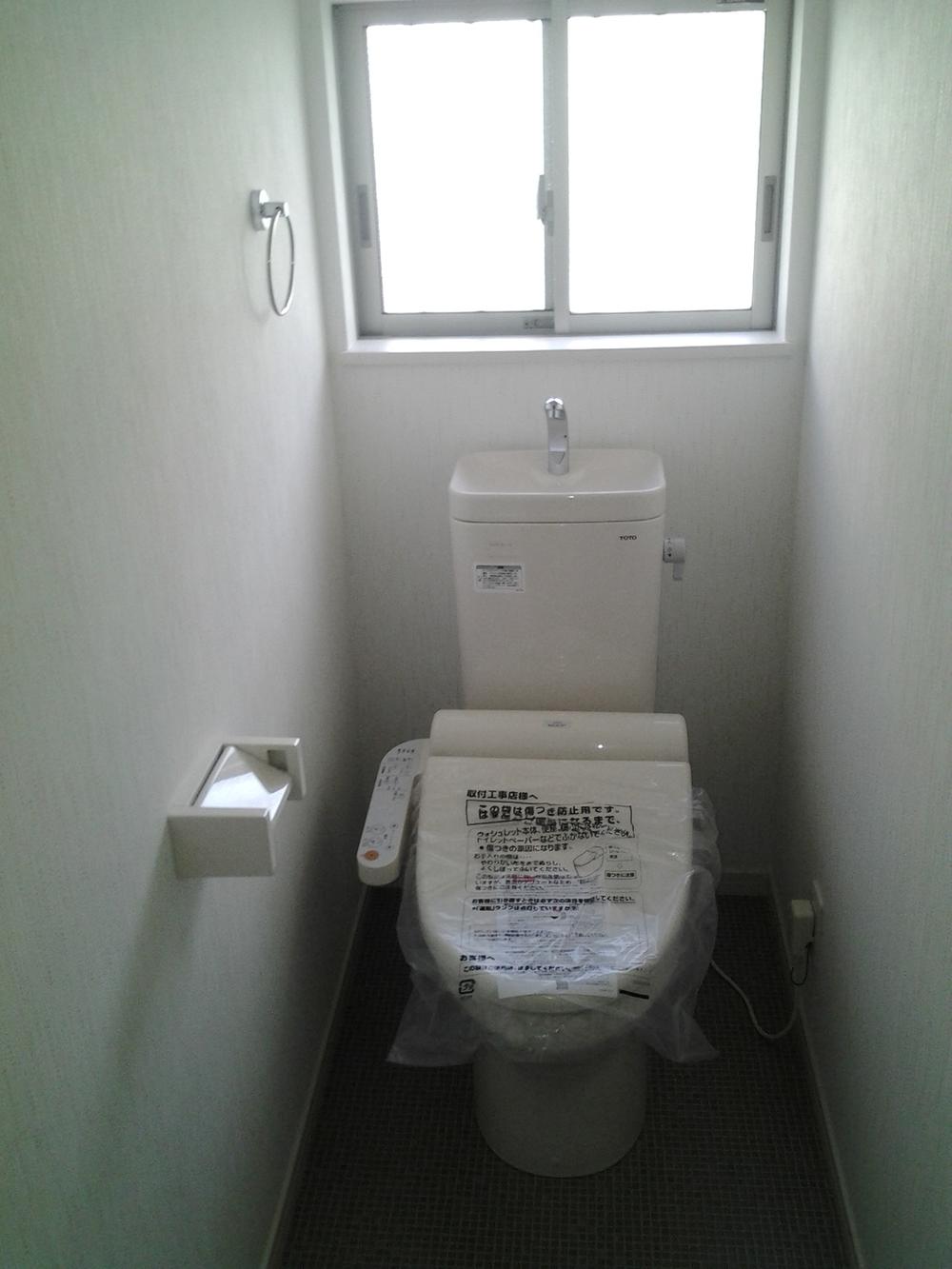 Toilet. It is a high-function toilet