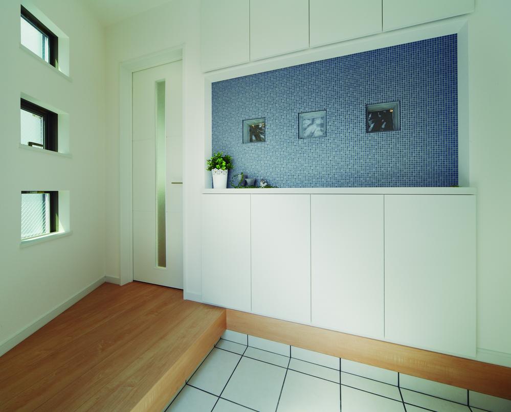 Entrance. Entrance of the storage lot is blue accents  [Model house]