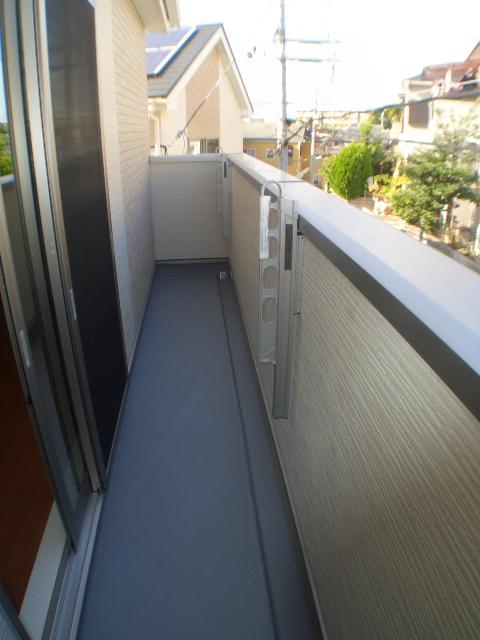 Balcony. It is with a pole hanging.