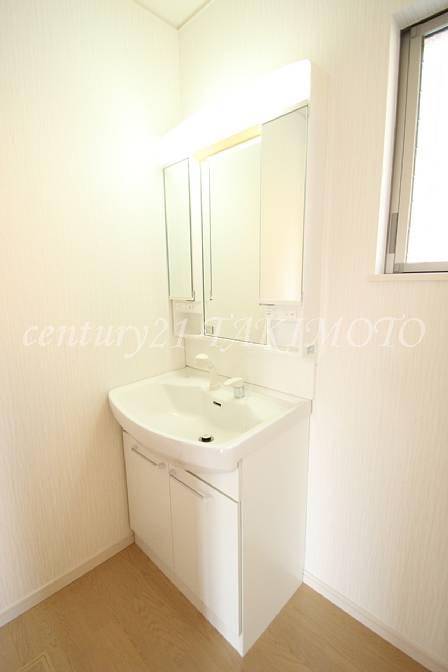 Wash basin, toilet. It sticks sunlight on the remote control to washroom.