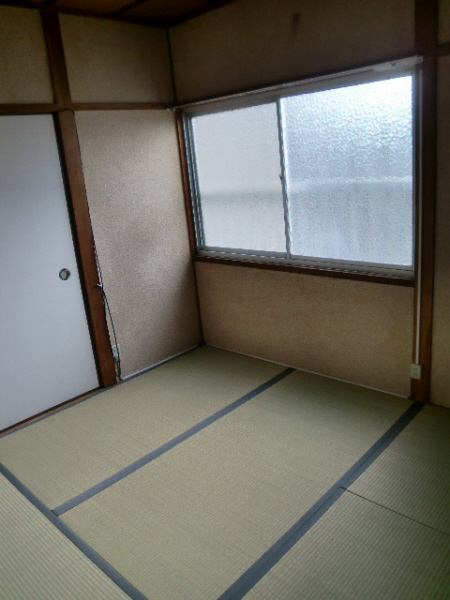 Living and room. It is a very bright room has a window.