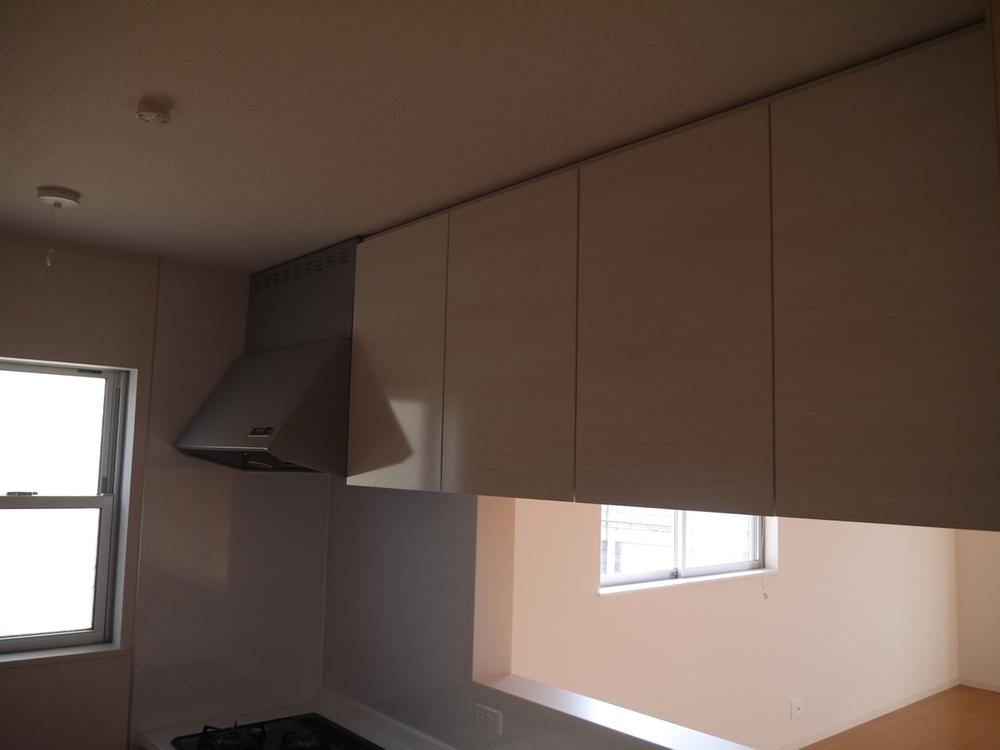 Kitchen. Located in the sink top, It is hanging cupboard