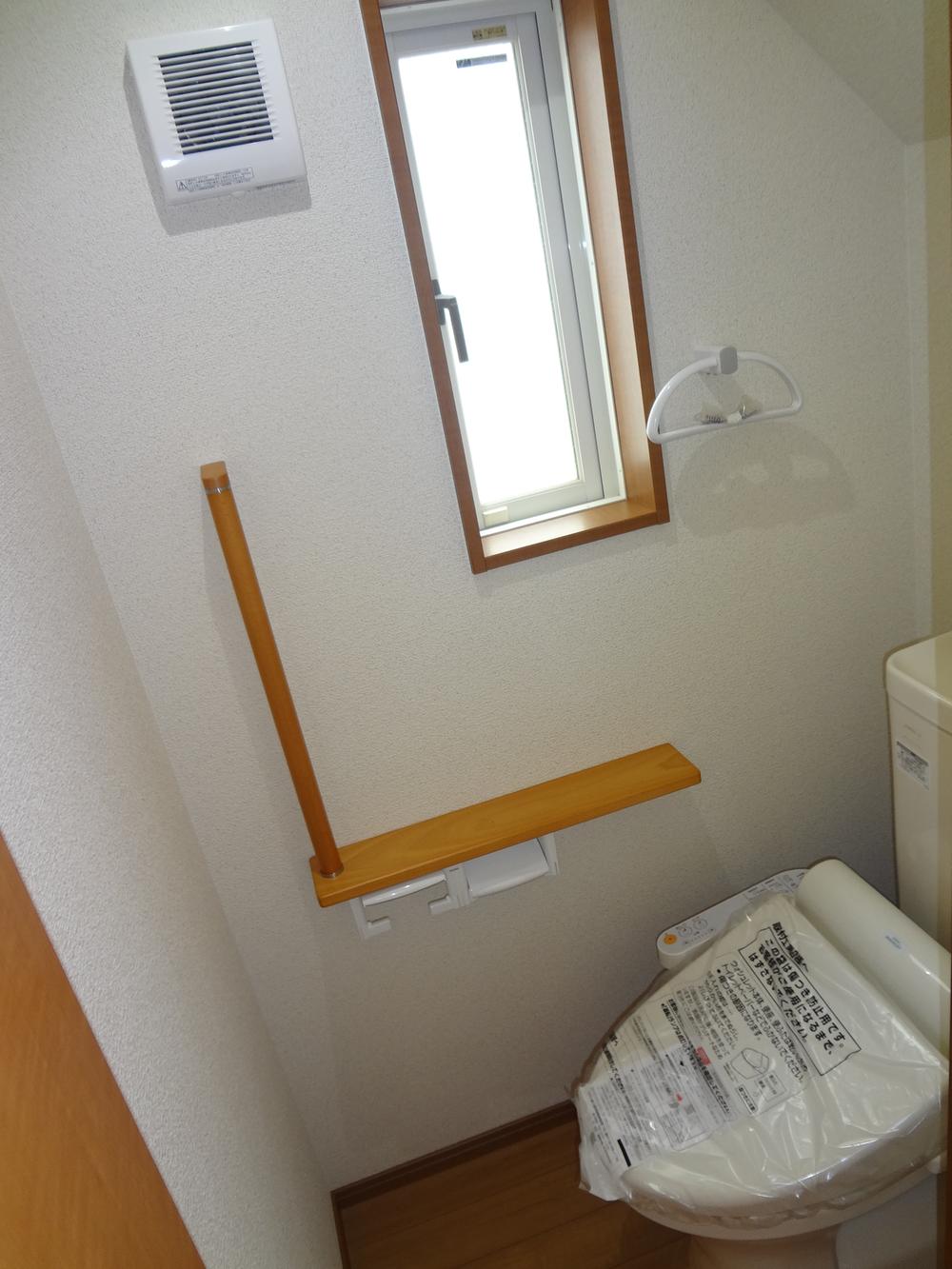 Toilet. It is a photograph of the toilet.