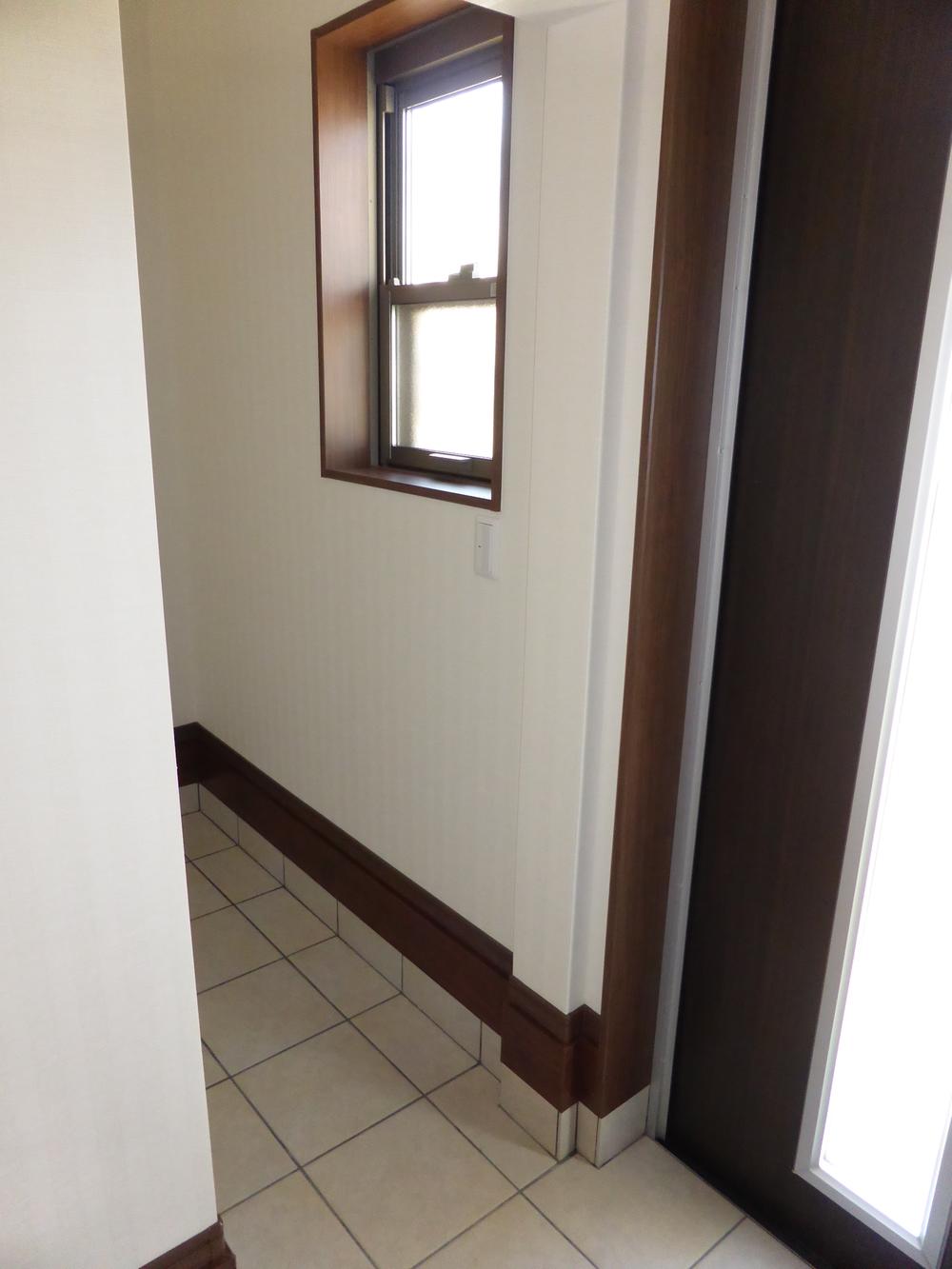 Entrance. It could use for storage of shoes cloak outdoor goods equipped with a door.