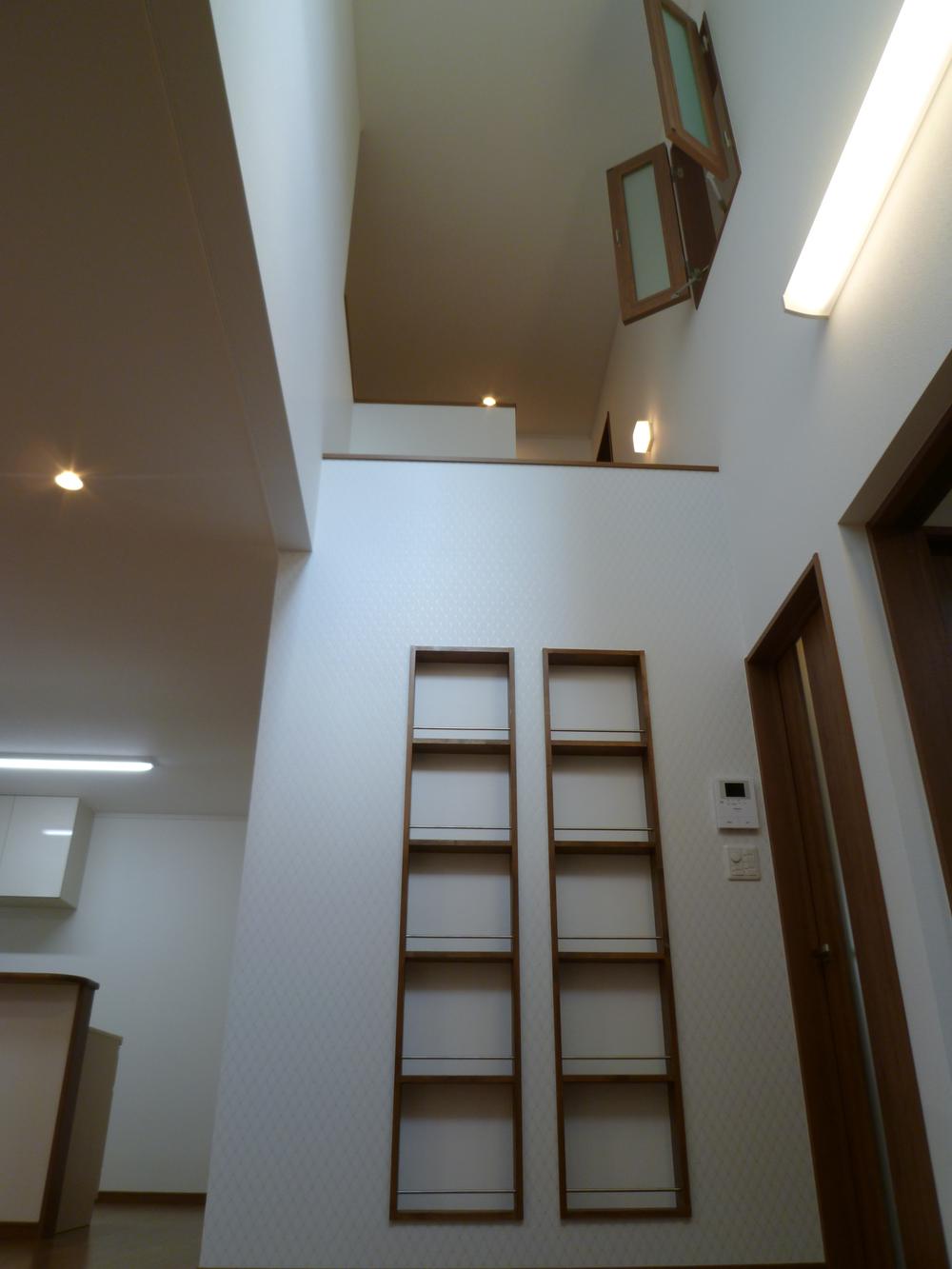 Living. Stylish bookshelf under the colonnade!