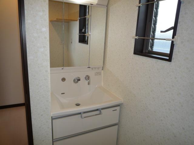 Wash basin, toilet. Three-sided mirror sounds wife is also also happy husband customers