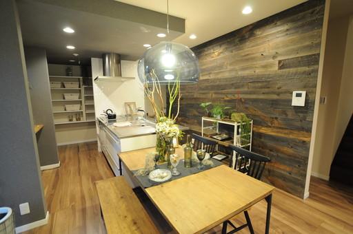 Model house photo. Night or, LDK of different atmosphere. Accent wall is full of atmosphere with old materials.