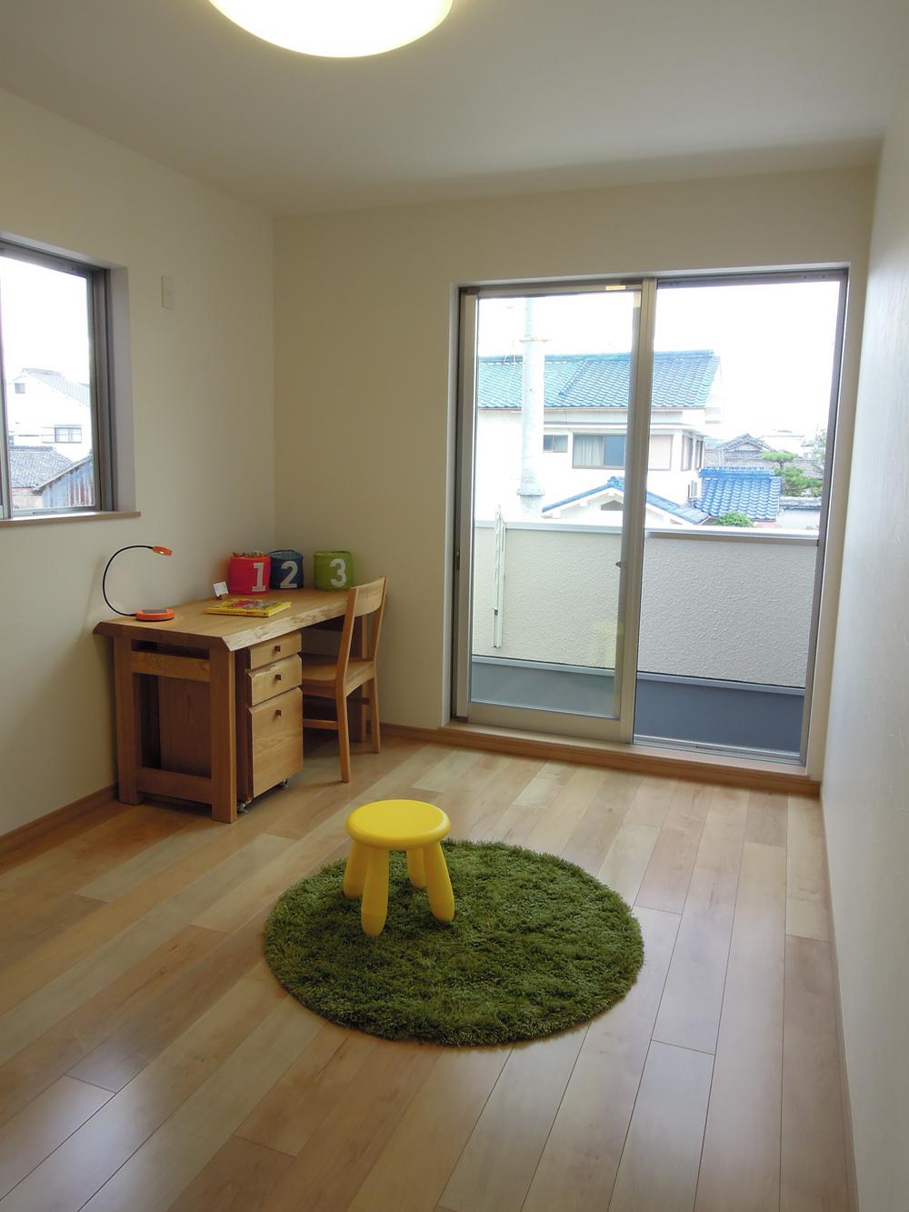 Model house photo. Children's Playground, facing the balcony