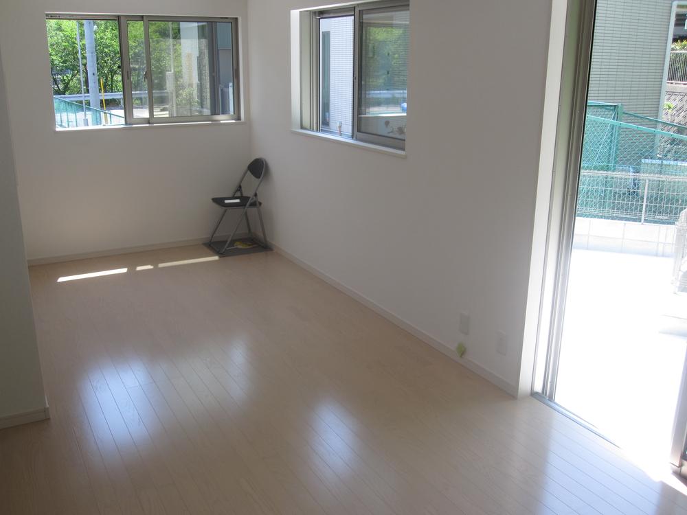 Living. The room bathed in pleasant sunshine