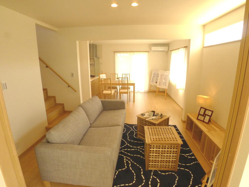 Model house photo. Bright living gathering of family