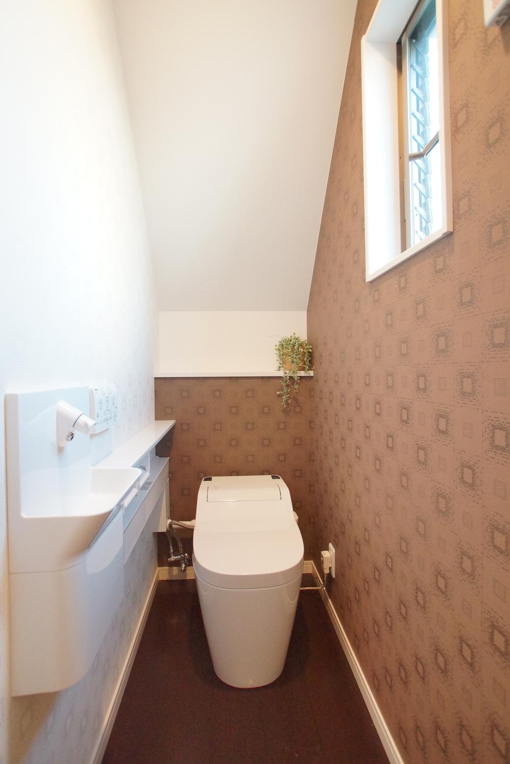 Toilet. Warm water washing toilet seat with hand washing counter! It is clear there is wide of 1 quire worth