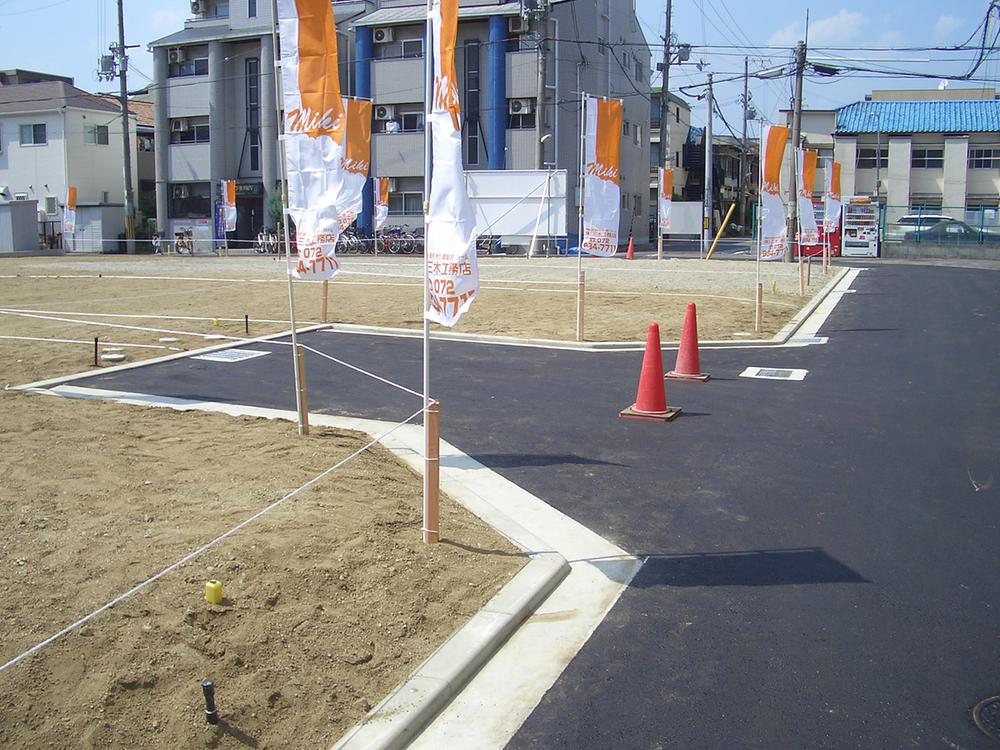 Local photos, including front road. Clean development subdivision in
