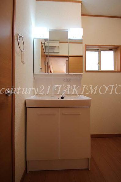 Wash basin, toilet. Vanity with storage plenty of shower