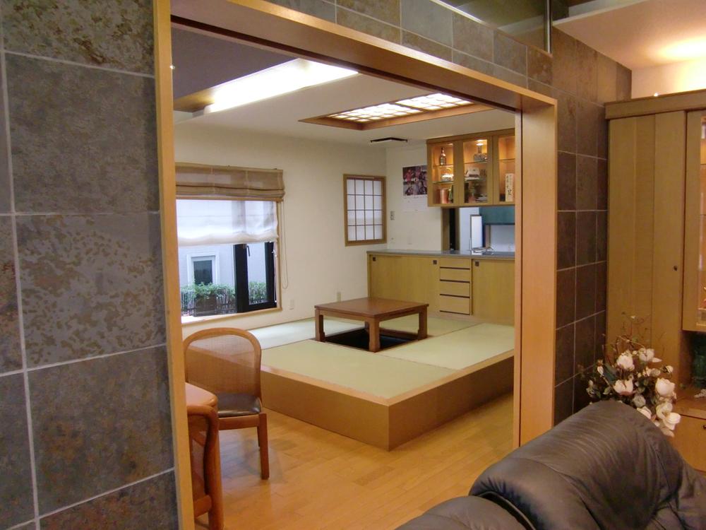 Living. It will be large space when releasing the door