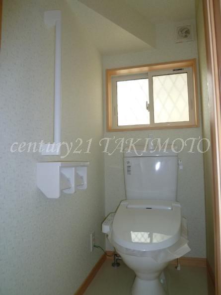 Toilet. Safe design equipped with a handrail