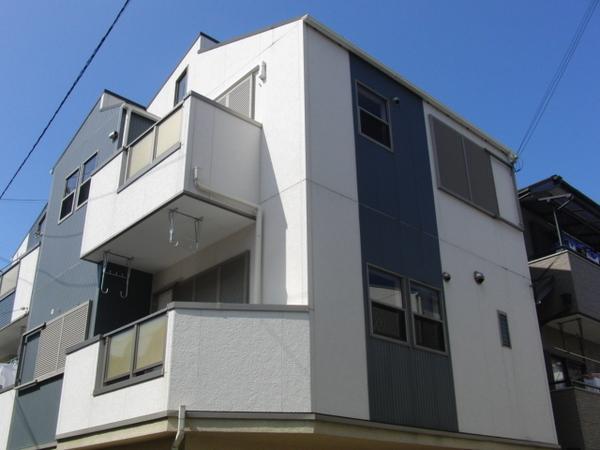 Local appearance photo. Three-story is a corner lot
