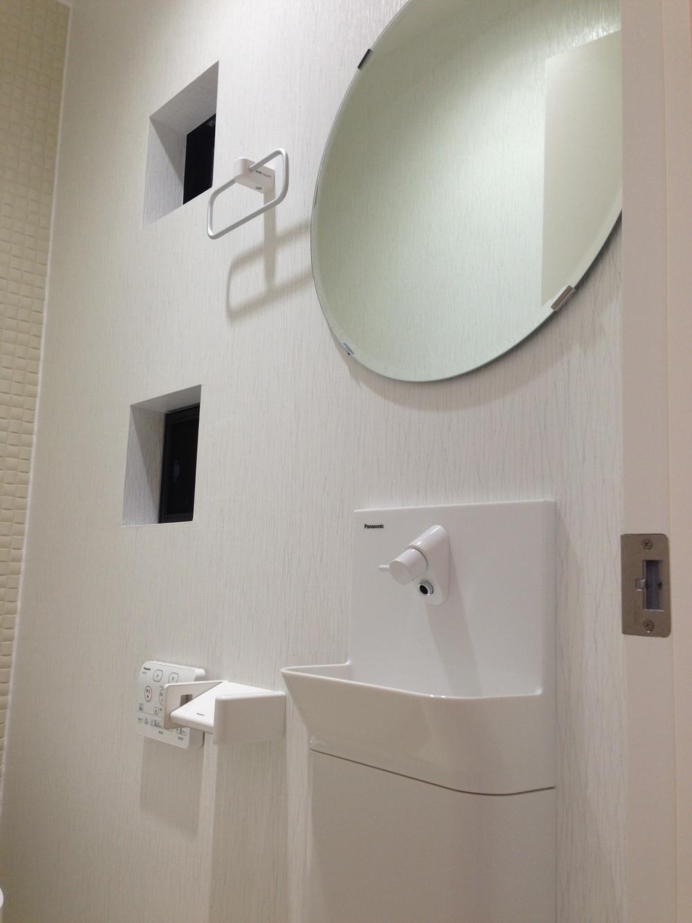 Toilet. Restroom angle photo. Also stuck to the design in detail.