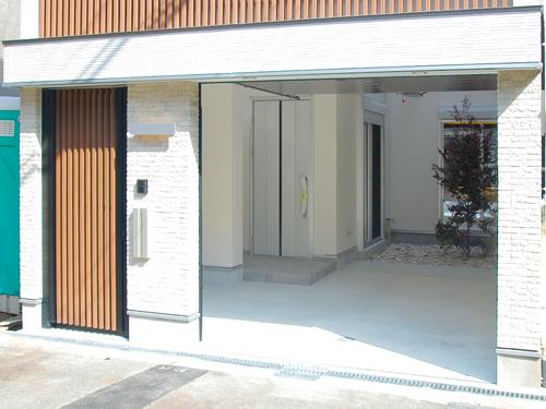 Model house photo. Our example of construction (garage with shutter)