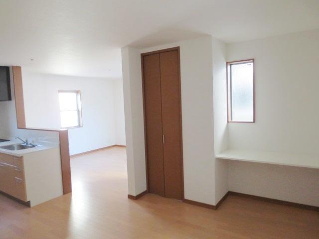 Living. There is a storage and counter to the living room, Convenient.