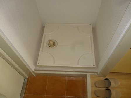 Other room space. There is a washing machine storage in the room