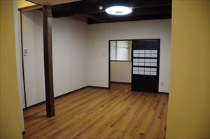 Living. Exposed beams will feel the age of the building. 