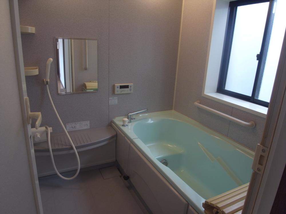 Bathroom. It is with the bath handrail. 