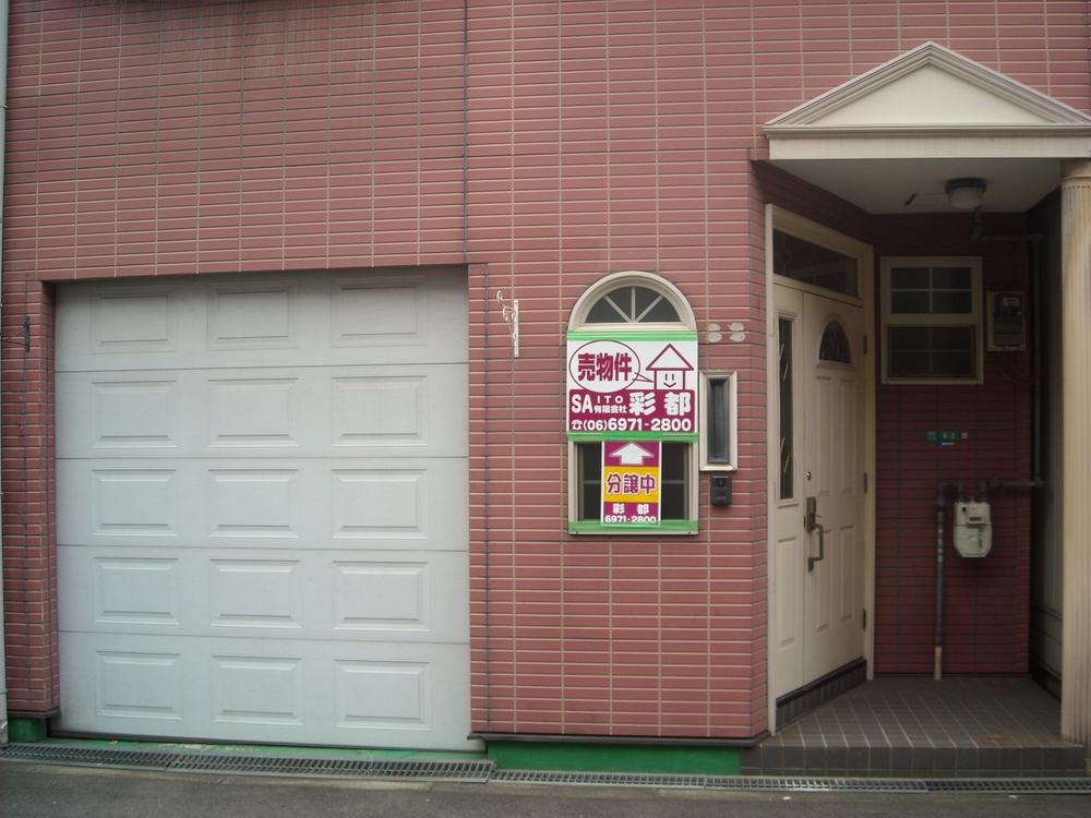 Local appearance photo. Large car capable of housing shuttered garage. 