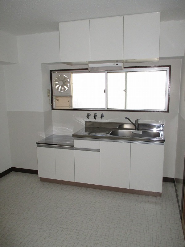 Kitchen. There is a window in the kitchen, Bright is