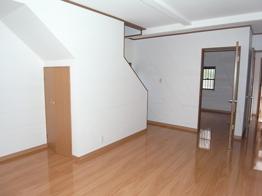 Living. Storage space is located under the stairs. 