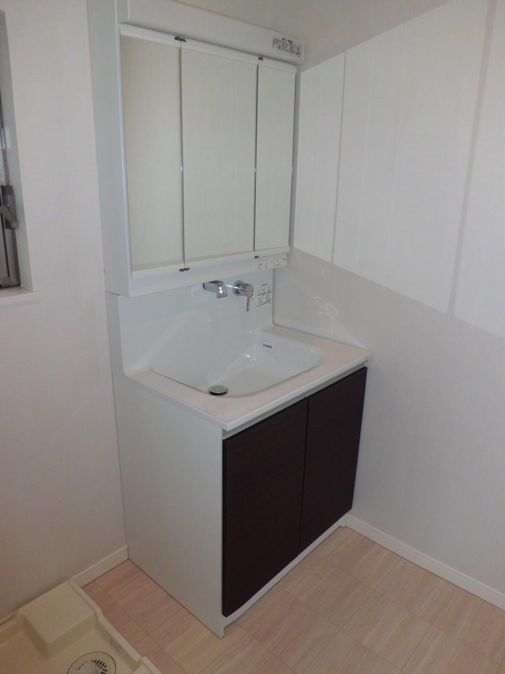 Wash basin, toilet. Housed plenty of wash room