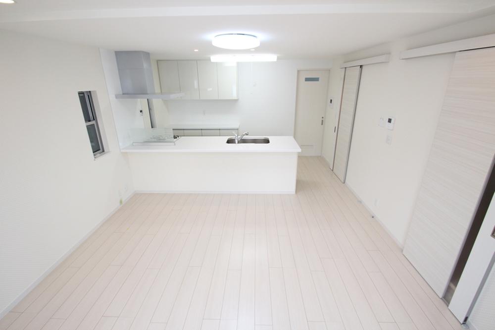 Living. I opened the photo right edge of the door there is a staircase leading to the third floor.