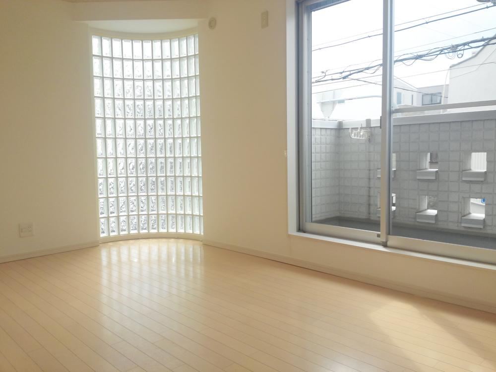 Living. It is a bright living room that incorporates a lot of daylight