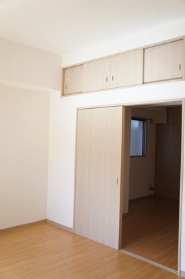 Living and room. It is with storage cupboards.