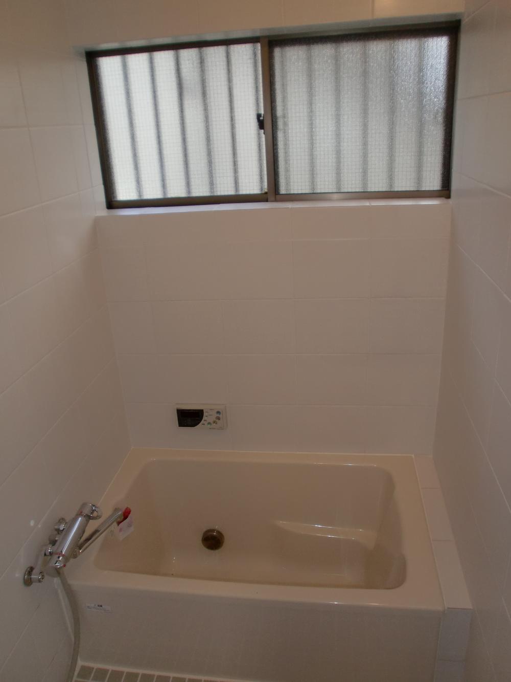 Bathroom. Is a bathroom tired there is a window is healing and.