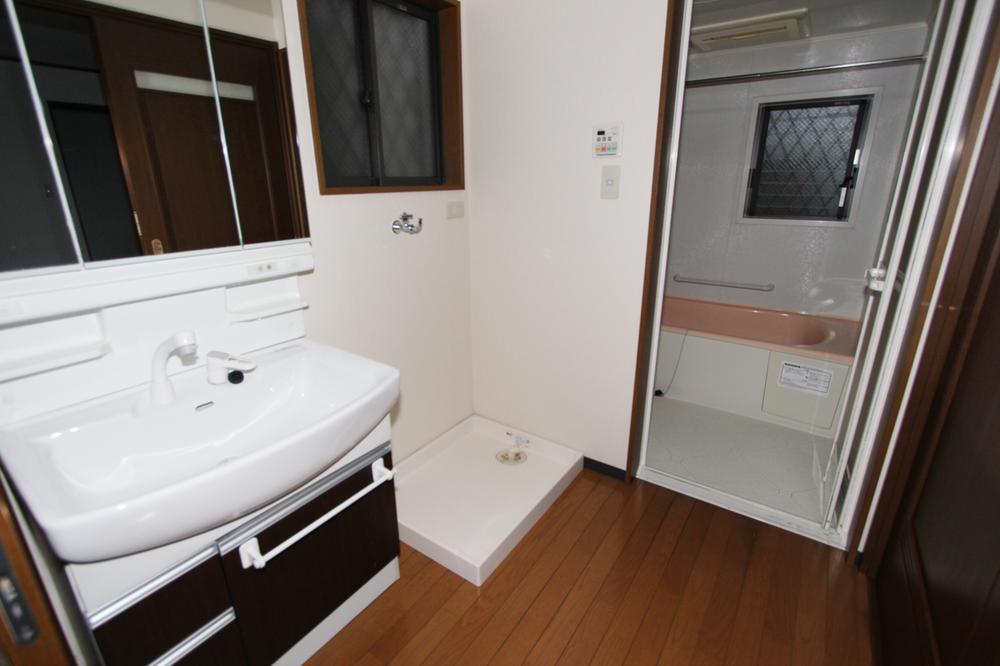 Wash basin, toilet. Vanity is, It is housed three-sided mirror. 