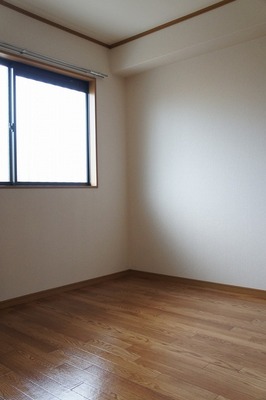 Living and room. It is bright with a window. 