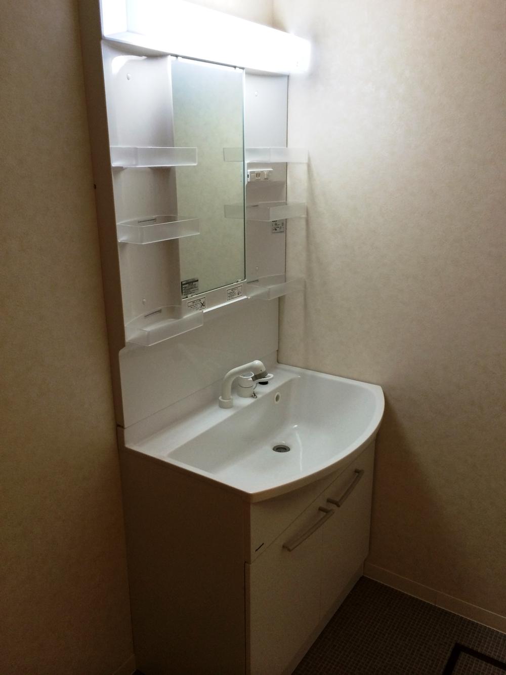 Wash basin, toilet. Wash basin is with shower.