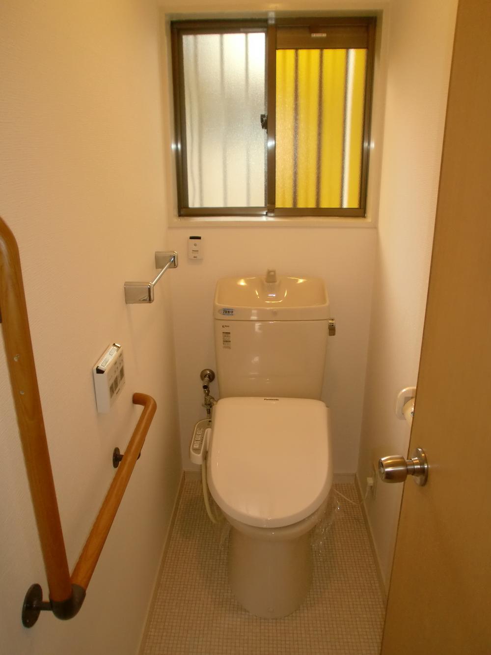 Toilet. It is peace of mind have also attached handrail.