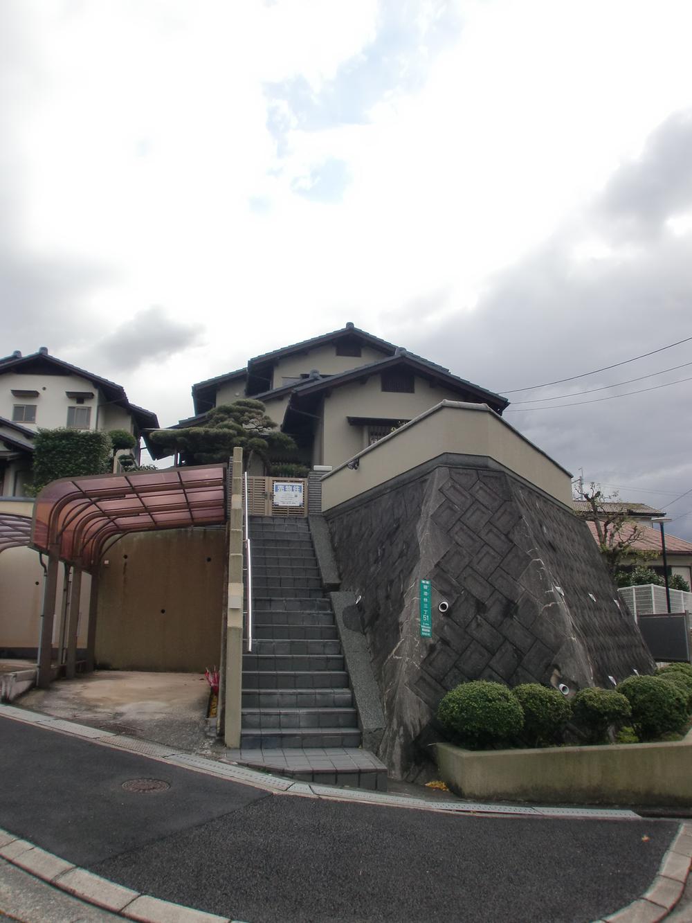 Local appearance photo. Is a mansion located in a quiet residential area.