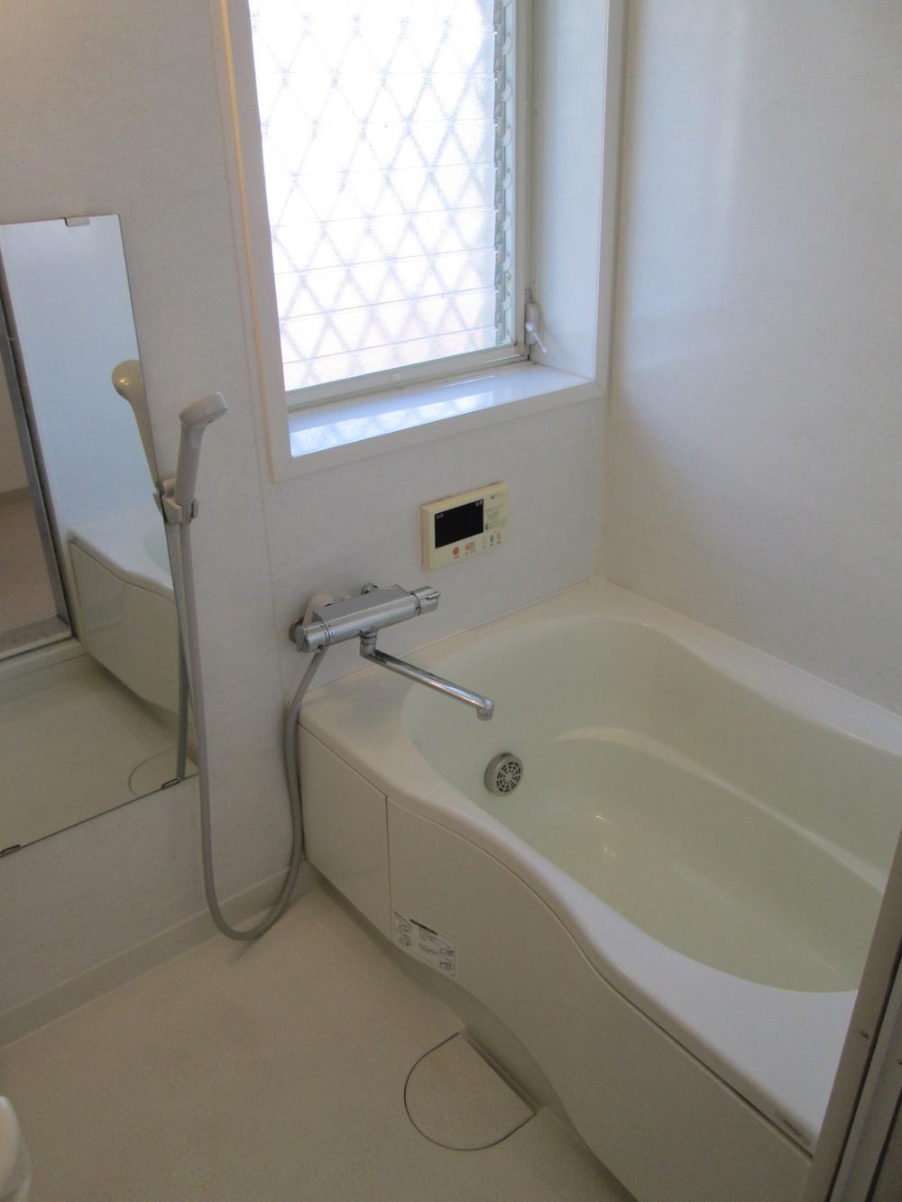 Bathroom. A clean bathroom. It is bright with window.