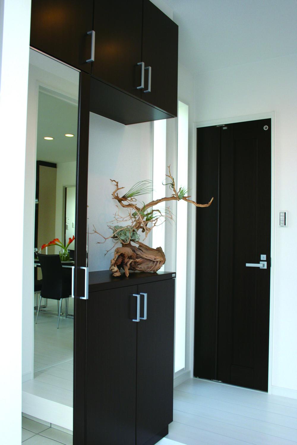 Entrance. Porch ceiling is full for the open feeling of the atrium