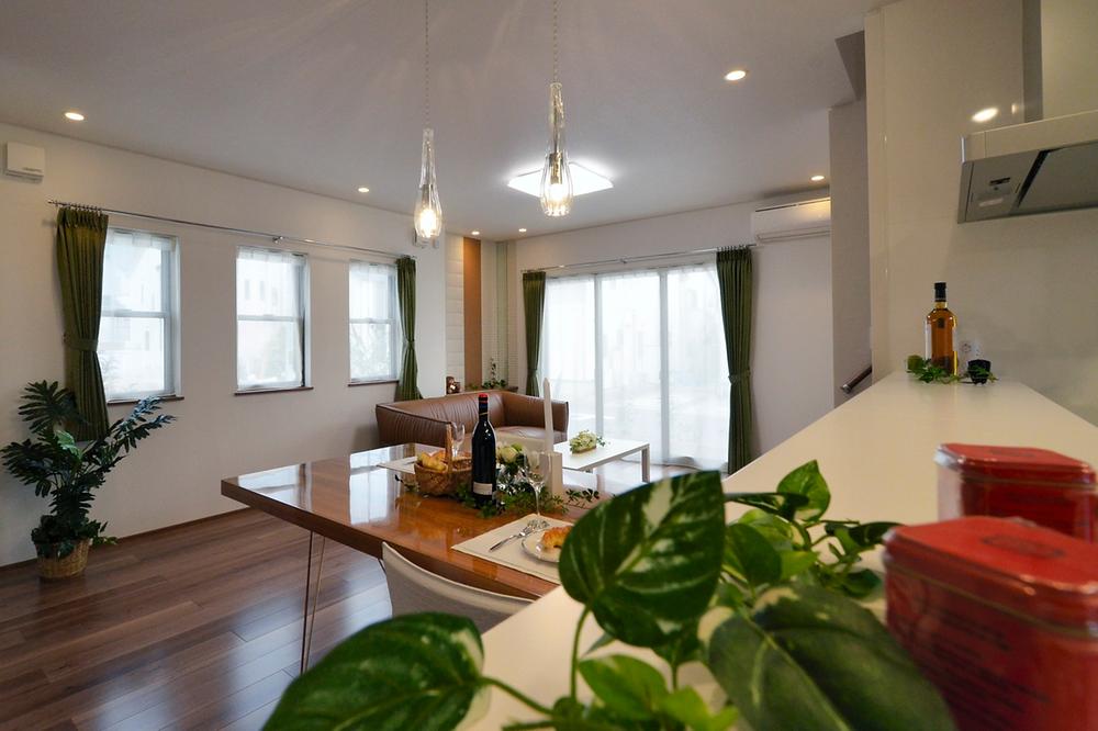 Living. Living the bright sunlight is coming through the large windows. As a space of family gatherings, I always likely to hear the laughter of the family. (Local model house)